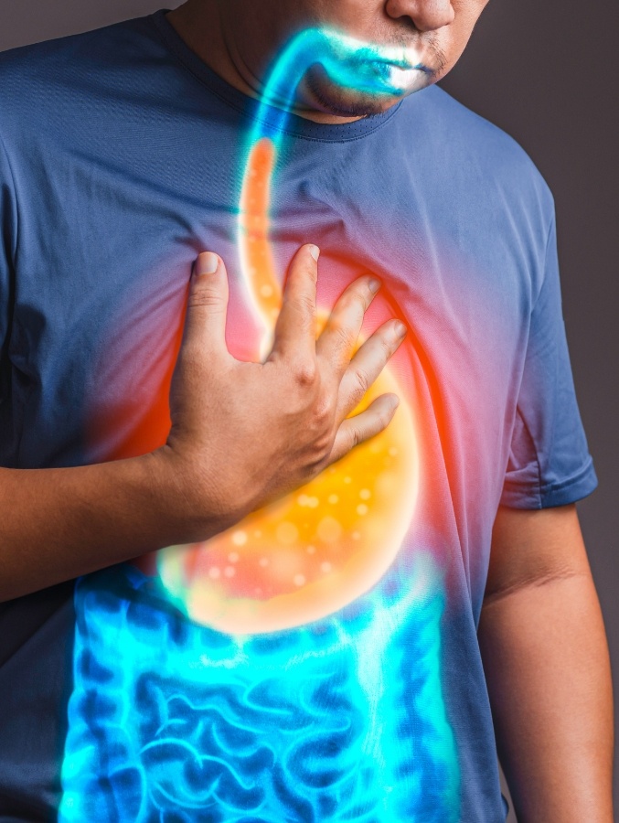 Man holding his chest with stomach outlined in orange