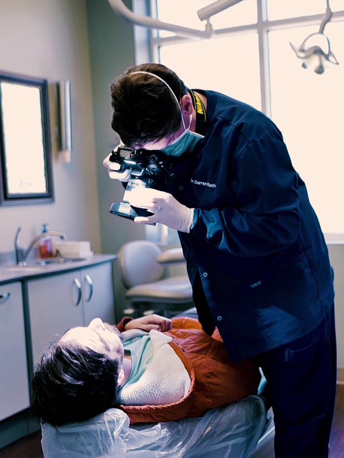 Dentist taking photo of patient's teeth