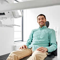 Male dental patient sitting in dental chair