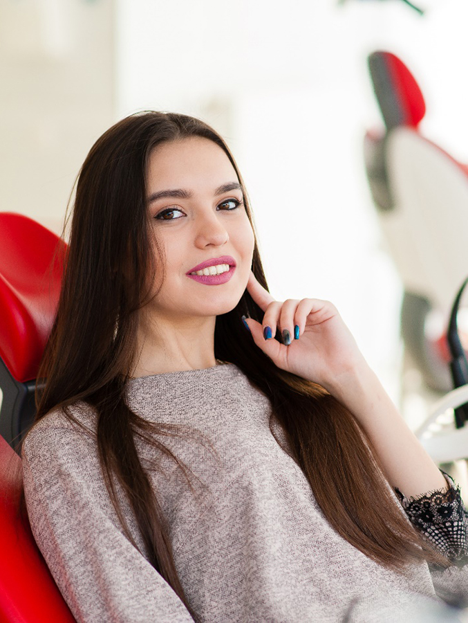 Female patient in dental chair waiting for treatment