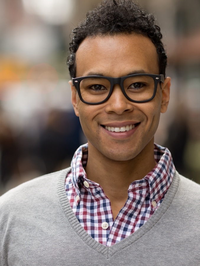 Man smiling with dental crowns and bridges in Cary
