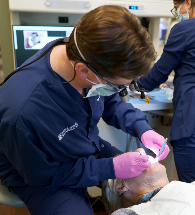 Dentist examining a patient's mouth