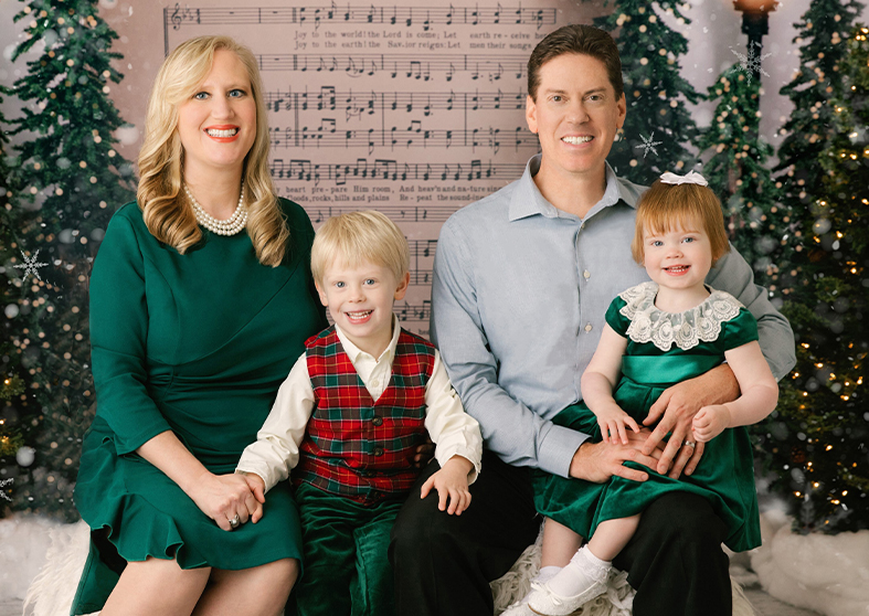 Doctor Koch and his family posing for a Christmas photo