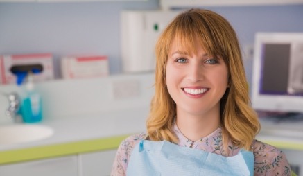 Woman smiling before receiving dental services in Cary
