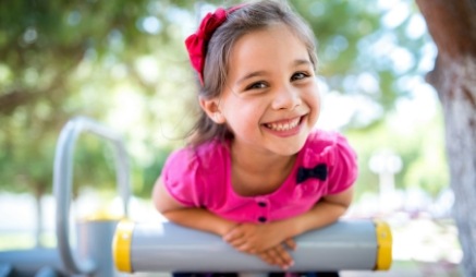 Young girl smiling on playground