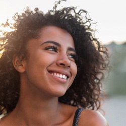 Close-up of a woman outside and smiling