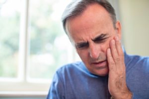 Man experiencing tooth pain