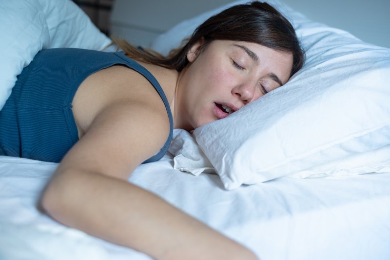 Woman with sleep apnea lying in bed