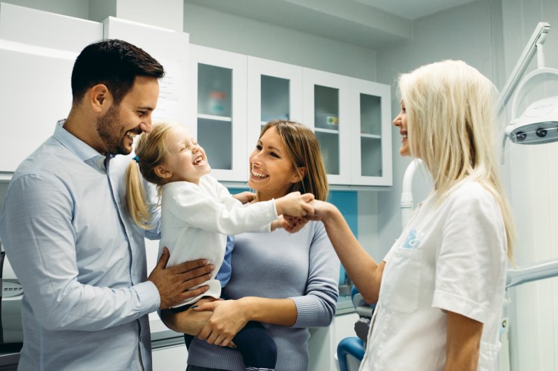 People meeting with a family dentist