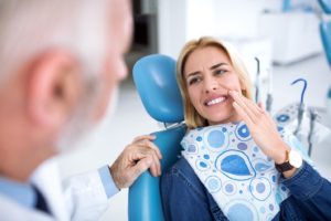 a patient visiting their dentist for a chipped tooth